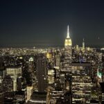 New York City skyline featuring Manhattan skyscrapers and iconic landmarks at sunset