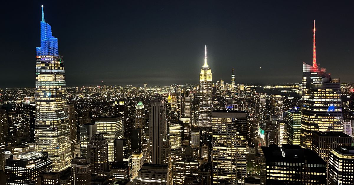 New York City skyline featuring Manhattan skyscrapers and iconic landmarks at sunset